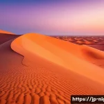 니제르에서의 모험 여행 옵션 - A breathtaking sunrise over the Sahara Desert sand dunes in Niger, with vibrant gradients of orange,...